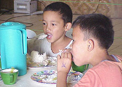 some boys enjoying the food